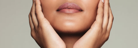 Woman with healthy, glowing skin in a beauty portrait.